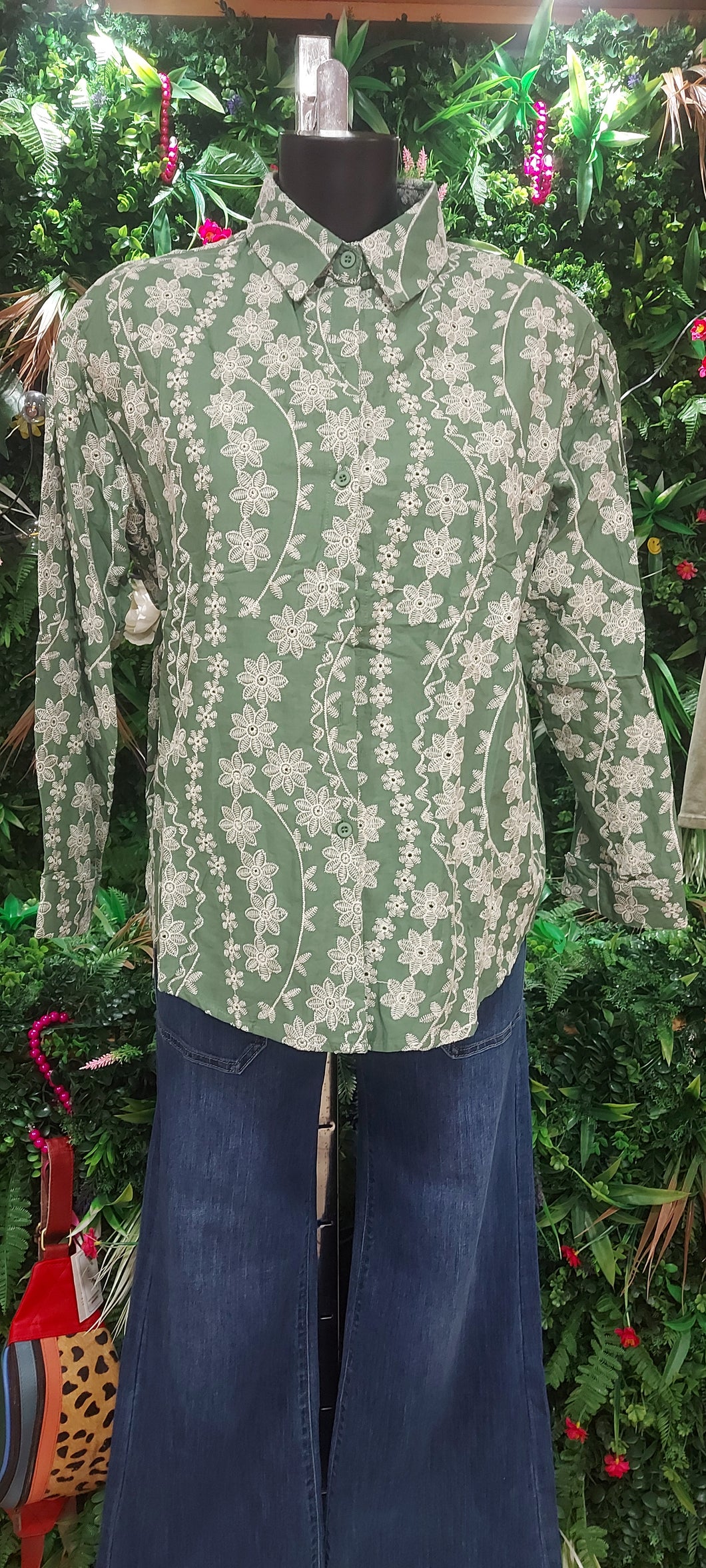 A kiki green embroidered blouse