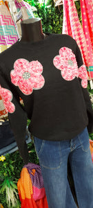 A jiko black knit sweater and pink flowerspink