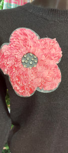 A jiko black knit sweater and pink flowerspink